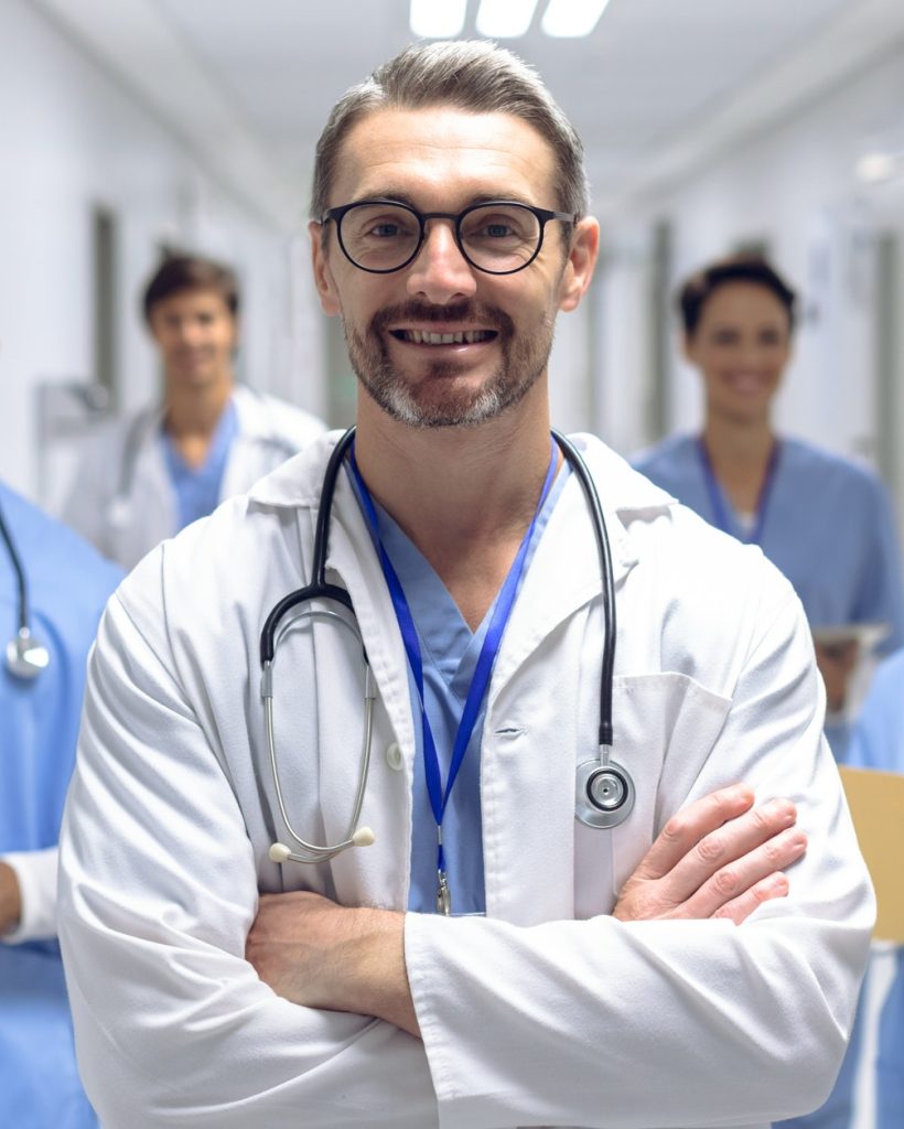 diverse-medical-team-of-doctors-looking-at-camera-while-holding-clipboard-and-medical-files.jpg